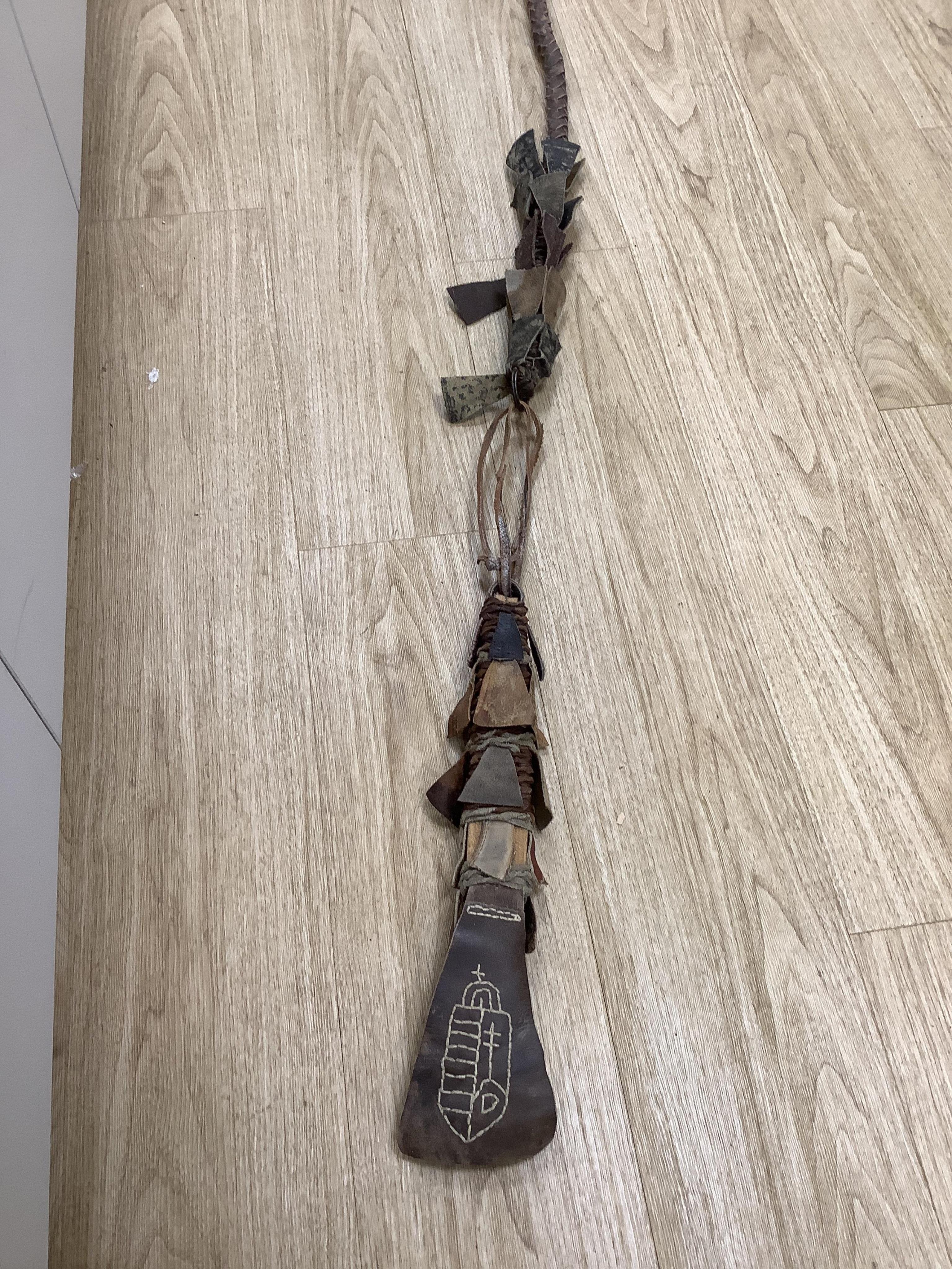 A group of Argentinian Gaucho spurs, bolas, bull whip, daggers and hanger, Longest 100cm